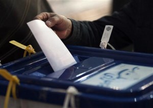 Iranian man casts his vote during Iran's parliamentary election in Tehran