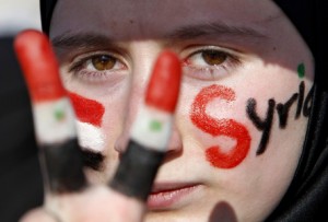 A Syrian girl takes part in a protest in Amman