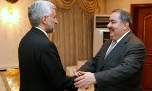 Iraq's foreign minister Hoshyar Zebari (r) welcomes Iran's national security chief Saeed Jalili.