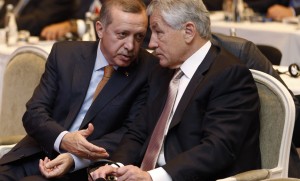 Turkey's PM Erdogan chats with Atlantic Council Chairman Hagel during the Black Sea Energy and Economic Forum in Istanbul