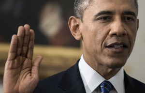 WASHINGTON, DC - JANUARY 20:  U.S. President Barack Obama is sworn in by Chief Justice John Roberts Jr. in the Blue Room of the White House during the 57th Presidential Inauguration January 20, 2013 in Washington, D.C.  Obama and U.S. Vice President Joe Biden were officially sworn in a day before the ceremonial inaugural swearing-in. (Photo by Brendan Smialowski-Pool/Getty Images)