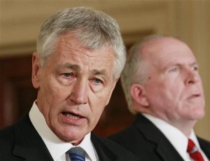 U.S. President Barack Obama's nominee for Secretary of Defense, former Senator Chuck Hagel (L), stands next to counterterrorism adviser John Brennan (R), the nominee for CIA Director, at the White House in Washington