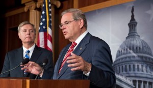 Senators Robert Menendez (R) and Lindsey Graham speak to reporters just after the Senate voted 99-0 in favor if the sanction package.