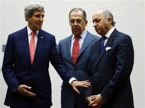 U.S. Secretary of State John Kerry (L) gestures towards French Foreign Minister Laurent Fabius (R) next to Russia's Foreign Minister Sergei Lavrov during a ceremony at the United Nations in Geneva November 24, 2013. REUTERS/Denis Balibouse