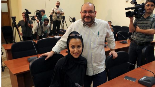 The Washington Post�s Iranian-American journalist Jason Rezaian (R) and his Iranian wife Yeganeh Salehi, who works for the UAE newspaper National, during a press conference in Tehran on September 10, 2013.