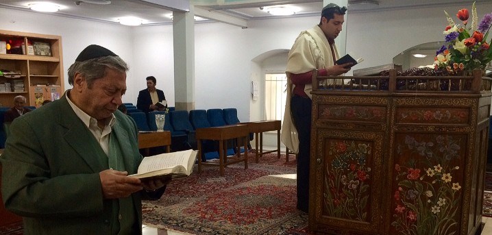 Jewish community leader Michael Malakon (R) leads prayers at the main synagogue in Esfahan, Iran.