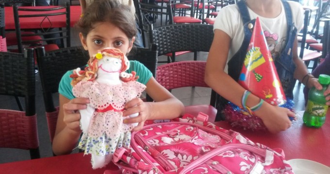 Iran donates doll to Syrian war-torn children